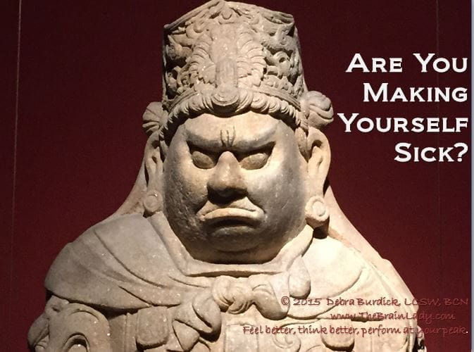 A fierce stone statue with a stern expression and text overlay.