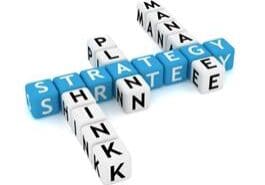 3D crossword puzzle with business terms like strategy, plan, think, and management.