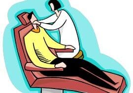 Dentist examining patient in dental chair.